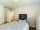 Bright bedroom with neutral decor and white wicker furniture at 1082 Nodding Shade Dr, Brooksville, FL 34604