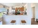 Modern kitchen with wooden cabinets and breakfast bar seating at 1082 Nodding Shade Dr, Brooksville, FL 34604