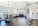Sun-filled living room features a dining area, large windows, and modern flooring at 1082 Nodding Shade Dr, Brooksville, FL 34604