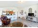 Open-concept living room view to the kitchen featuring updated appliances and hardwood floors at 1082 Nodding Shade Dr, Brooksville, FL 34604