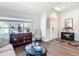 Inviting living room features stylish furniture, modern flooring, and natural light from a large window at 1082 Nodding Shade Dr, Brooksville, FL 34604