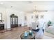 Bright living room features modern flooring, a stylish seating area, and a dining space with a glass table at 1082 Nodding Shade Dr, Brooksville, FL 34604