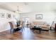 Bright living room features modern flooring, a stylish seating area, and a dining space with a glass table at 1082 Nodding Shade Dr, Brooksville, FL 34604