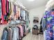 Spacious walk-in closet with ample shelving and hanging storage for clothes and accessories at 1082 Nodding Shade Dr, Brooksville, FL 34604