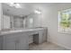 Bathroom with double sinks, modern vanity, and tile flooring at 11310 Limpkin Rd, Weeki Wachee, FL 34614