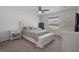 Airy main bedroom featuring a ceiling fan and white furniture set at 11310 Limpkin Rd, Weeki Wachee, FL 34614