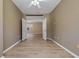 Empty bedroom showcasing modern floors and natural light at 1171 Dartford Dr, Tarpon Springs, FL 34688
