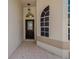 View of the front entryway showing a tiled floor, door, and transom at 1171 Dartford Dr, Tarpon Springs, FL 34688