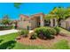 Charming home features a red tile roof and lush landscaping at 1171 Dartford Dr, Tarpon Springs, FL 34688