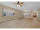 Inviting living room with window views and open access to the kitchen and front entry at 1171 Dartford Dr, Tarpon Springs, FL 34688