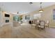 Spacious living room boasts hardwood floors, a fireplace, and ample natural light at 1171 Dartford Dr, Tarpon Springs, FL 34688