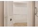 Walk-in closet with white shelving and hardwood floor offers ample storage space at 1171 Dartford Dr, Tarpon Springs, FL 34688