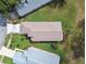 Aerial view of a well-maintained house, showcasing a light-brown roof and neat landscaping in a residential neighborhood at 11732 Wheatfield Loop, Hudson, FL 34667