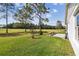 Well maintained yard with lush grass and a view of the community golf course at 11732 Wheatfield Loop, Hudson, FL 34667