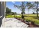 Patio with view of landscaping, pond, and golf course at 11732 Wheatfield Loop, Hudson, FL 34667