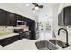 Stylish kitchen with granite counters, stainless appliances, and open layout to living area at 11732 Wheatfield Loop, Hudson, FL 34667