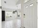 Bright living area with neutral tile, windows, and decor, creating a cozy, inviting atmosphere at 11732 Wheatfield Loop, Hudson, FL 34667