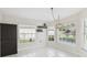Light-filled dining area with ample natural light and pendant lighting, providing an inviting atmosphere at 11732 Wheatfield Loop, Hudson, FL 34667