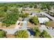 Aerial view of a home nestled in a neighborhood setting with mature trees at 12065 Shadow Ridge Blvd, Hudson, FL 34669