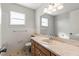 Bathroom with vanity, sink, toilet and bright lighting at 12065 Shadow Ridge Blvd, Hudson, FL 34669