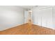 Empty room with hardwood floors, white walls, and a closet at 12065 Shadow Ridge Blvd, Hudson, FL 34669