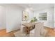 Bright dining room with wood table, four chairs, and natural light, perfect for Gathering meals at 12065 Shadow Ridge Blvd, Hudson, FL 34669