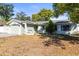 Lovely single-story home with a well-manicured front yard and a welcoming facade at 12065 Shadow Ridge Blvd, Hudson, FL 34669