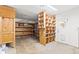 Spacious garage has ample shelving for storage and a door to the side yard at 12065 Shadow Ridge Blvd, Hudson, FL 34669