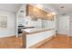 Open kitchen with wooden counter and stainless steel appliances at 12065 Shadow Ridge Blvd, Hudson, FL 34669