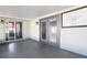 Covered and screened-in patio includes outdoor lights, a painted floor, and double doors at 12065 Shadow Ridge Blvd, Hudson, FL 34669