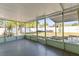 Screened in porch gives an unobstructed view of the backyard with large fence and landscaping at 12065 Shadow Ridge Blvd, Hudson, FL 34669