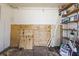 Interior of shed featuring plywood, shelves, and an assortment of storage items at 12065 Shadow Ridge Blvd, Hudson, FL 34669