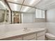 Bathroom featuring a vanity with a white countertop, and a mirror at 12204 Pepper Mill Dr, Hudson, FL 34667
