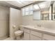 Neutral bathroom features a walk-in shower and a sleek, modern vanity at 12204 Pepper Mill Dr, Hudson, FL 34667