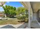 Inviting front porch with classic columns and views of a lush, green yard at 12204 Pepper Mill Dr, Hudson, FL 34667