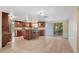 Spacious open floor plan of the kitchen provides ample space for an island with barstool seating at 12204 Pepper Mill Dr, Hudson, FL 34667