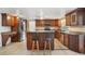 Updated kitchen features stainless appliances, custom cabinets and a center island with seating at 12204 Pepper Mill Dr, Hudson, FL 34667