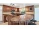 The kitchen boasts updated countertops, stainless appliances and a large island with bar seating at 12204 Pepper Mill Dr, Hudson, FL 34667