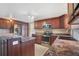 Well-equipped kitchen with stainless appliances, custom cabinets, and updated granite counters at 12204 Pepper Mill Dr, Hudson, FL 34667