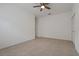 Neutral bedroom with tiled floors, a ceiling fan and closet providing an inviting space at 1260 Dartford Dr, Tarpon Springs, FL 34688