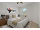 Bright bedroom with ceiling fan, natural light and neutral decor at 1260 Dartford Dr, Tarpon Springs, FL 34688