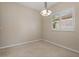 Bright dining room with tile flooring, shutters on the window for privacy and neutral wall color at 1260 Dartford Dr, Tarpon Springs, FL 34688