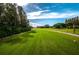 Scenic golf course with lush green fairways and a clear blue sky at 1260 Dartford Dr, Tarpon Springs, FL 34688