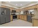 Modern kitchen featuring stainless steel appliances, ample cabinetry, and a functional layout at 1260 Dartford Dr, Tarpon Springs, FL 34688