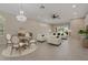 Spacious open floor plan combining dining and living areas with stylish furnishings and elegant decor at 1260 Dartford Dr, Tarpon Springs, FL 34688