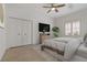 Nicely decorated main bedroom with tiled floors, ceiling fan, closet, and a comfortable, inviting feel at 1260 Dartford Dr, Tarpon Springs, FL 34688