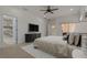 Beautifully appointed main bedroom offering access to the lanai and ensuite bathroom at 1260 Dartford Dr, Tarpon Springs, FL 34688