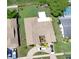 An aerial view of a property's backyard, a patio, and driveway with parking at 13111 Sheridan Dr, Hudson, FL 34667
