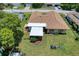 Overhead view of a well-maintained home with green grass and a backyard at 13111 Sheridan Dr, Hudson, FL 34667