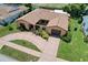 An elevated view showcases the home's unique layout, circular driveway, and mature landscaping at 13111 Sheridan Dr, Hudson, FL 34667
